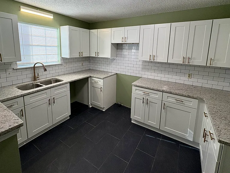 Kitchen appliances installed since picture was taken.