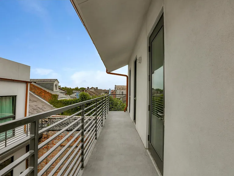 The terrace on the third floor extends the length of the building and offers quaint, rooftop views of the French Quarter.