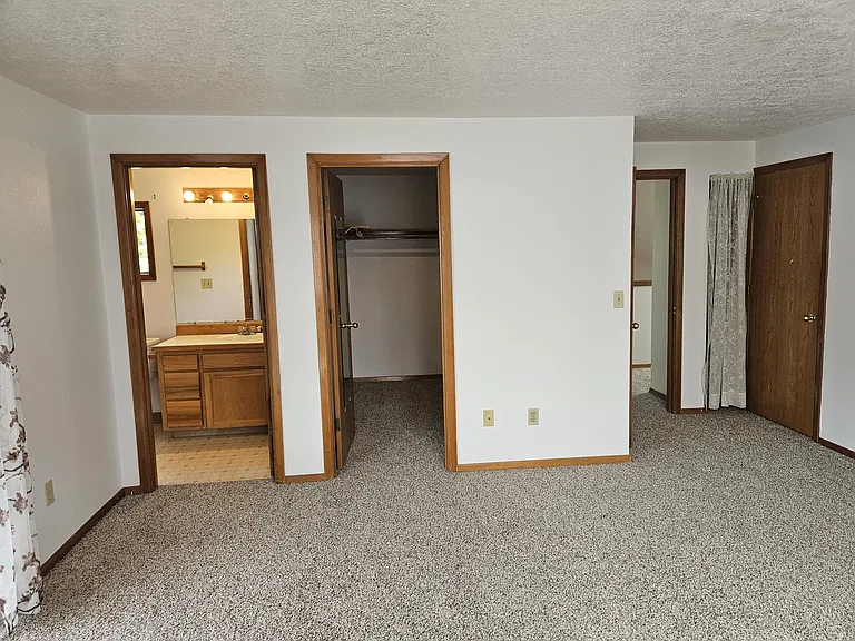 master bedroom upstairs with sliding door to patio on suite bathroom & 2 walk in closets