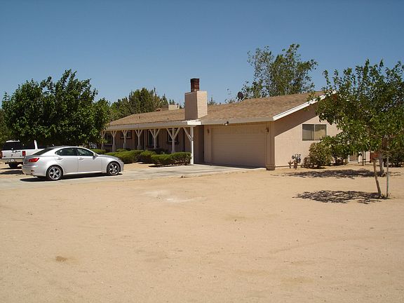 Side Of House And View Of Drive Way.