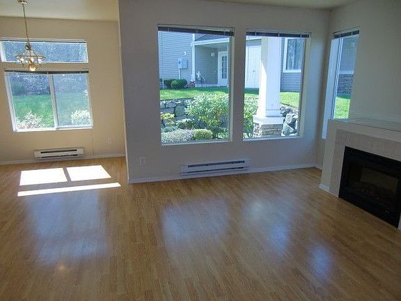You'll be greeted by a light and bright living area!