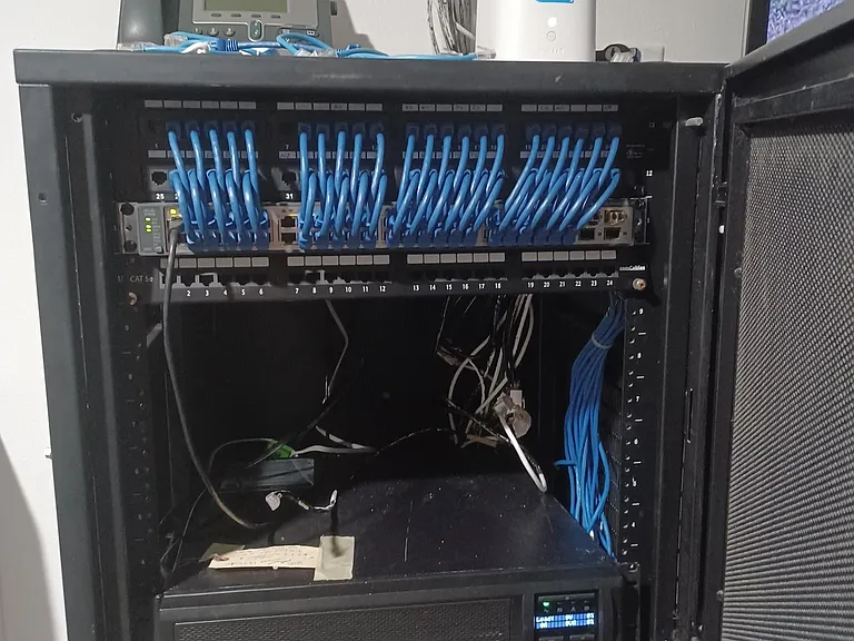 Core patch panel, Cisco 48 port POE switch, and APC battery backup