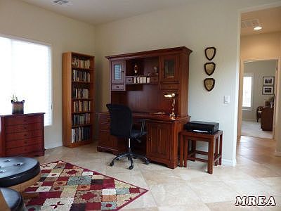 Den with upgraded window covering