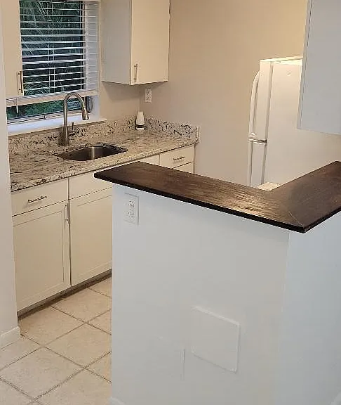 Breakfast bar and kitchen from dining area.