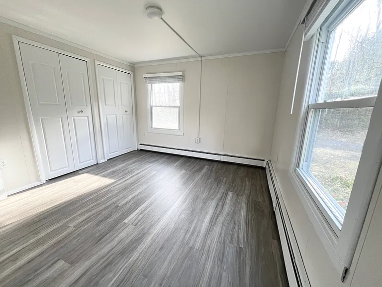 Master Bedroom with two closets and ensuite bathroom (view from the bathroom)