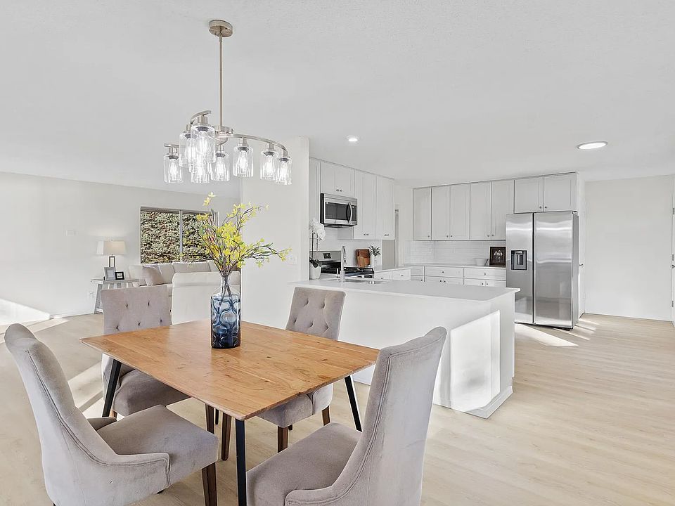 Dining room and kitchen. Note: unit comes unfurnished.