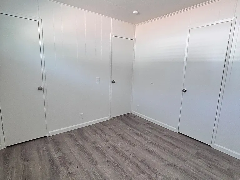The primary bedroom serves as a private retreat, offering a spacious and comfortable setting to unwind at the end of the day.