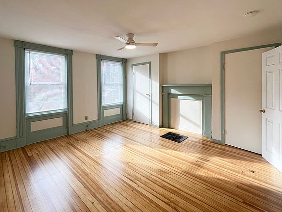 bedroom with two closets and plenty of natural light