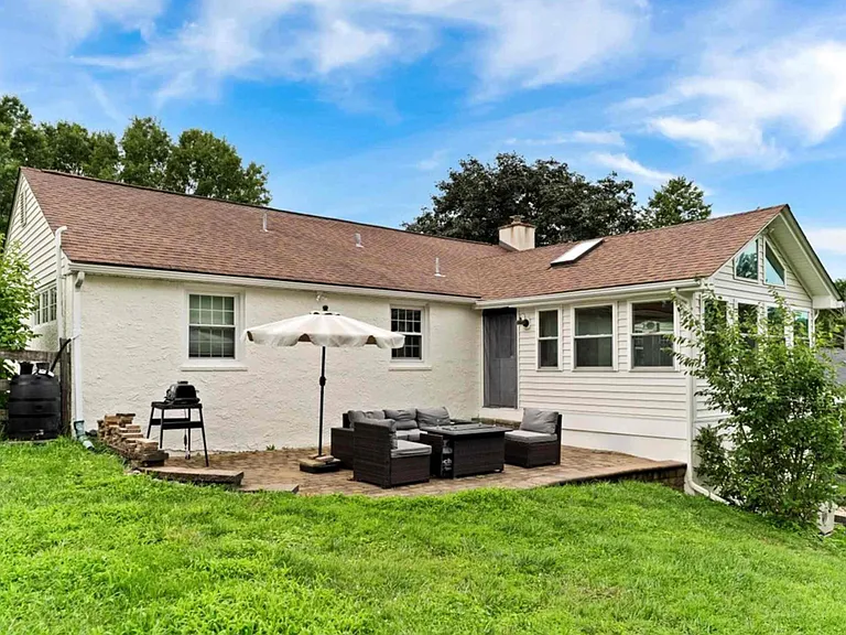 Backyard with patio furniture, grill, and propane fire pit. Perfect for watching all the wildlife!