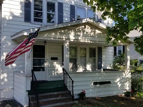 Front of house with porch.
