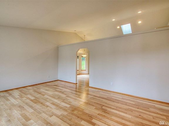 Enter into this large living area with vaulted ceilings and fresh new paint throughout.