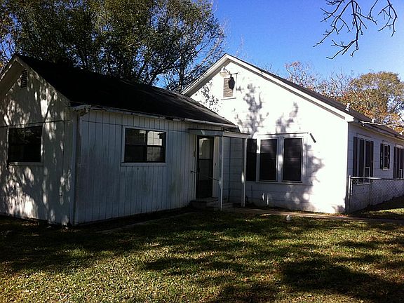 Rear of home with view of Master or mother in law suite