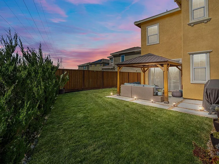 Backyard - now it's upgraded to low-maintenance concrete floors