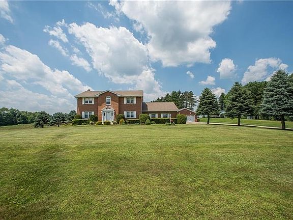 This view of the home shows the setback from Bocktown Cork Road and the long level drive that leads to the 3 car attached and 2 