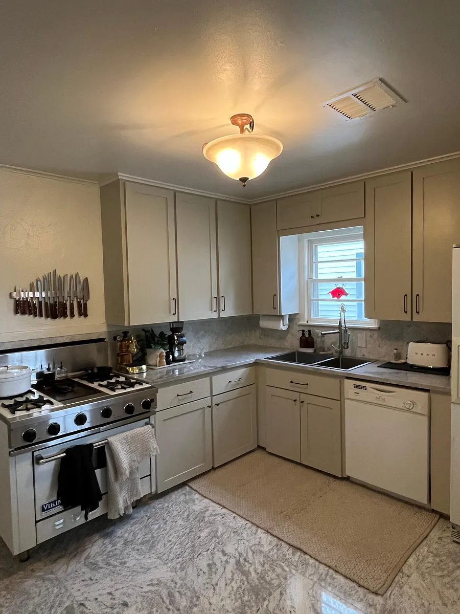 Kitchen with Viking gas range and carrera marble counters. Dishwasher & Fridge have recently been replaced with new stainless steel appliances. - 1363 E 43rd St