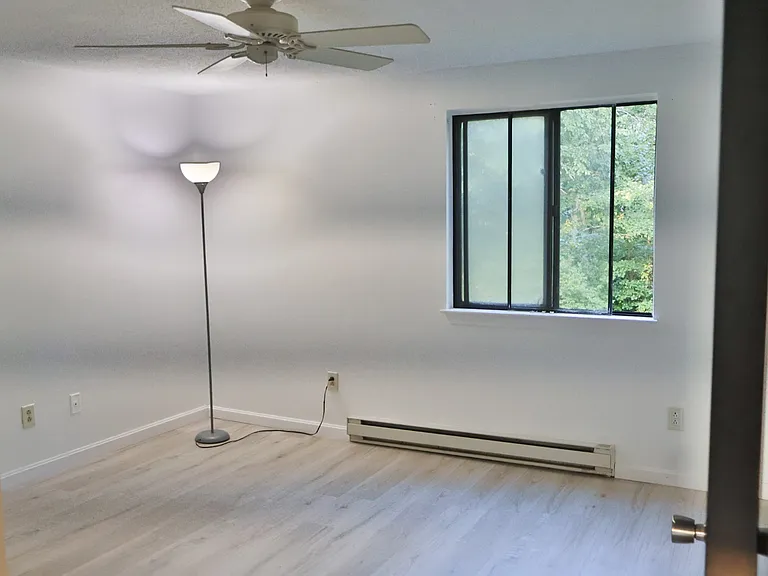 Bedroom 1 _ Fully Renovated with Freshly Painted Walls and Doors, Plus Brand-New Flooring Throughout.