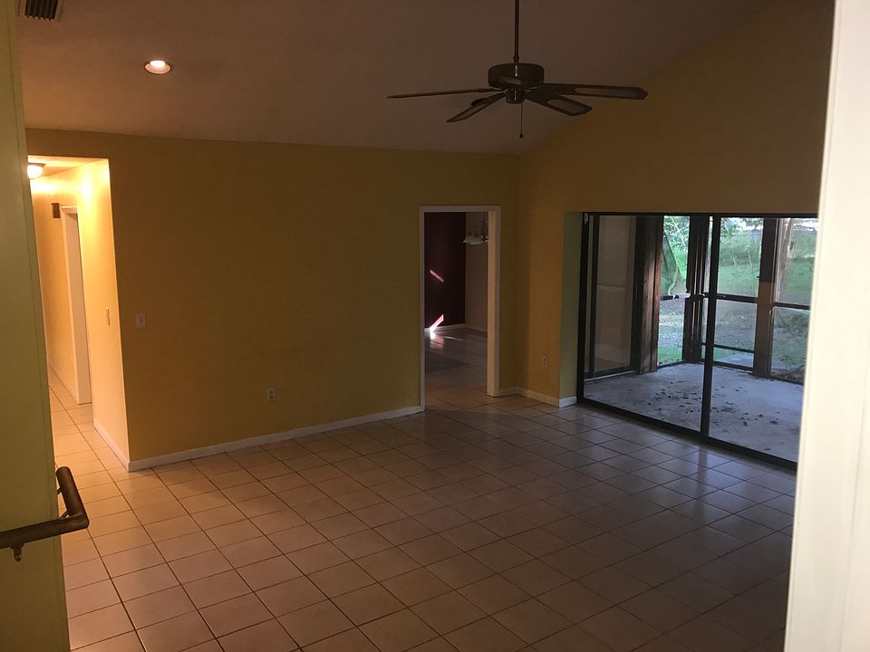 Large family room with fireplace bolted ceiling and 14 foot