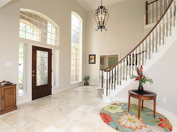 Graceful two story foyer provides an immediate "welcome".
