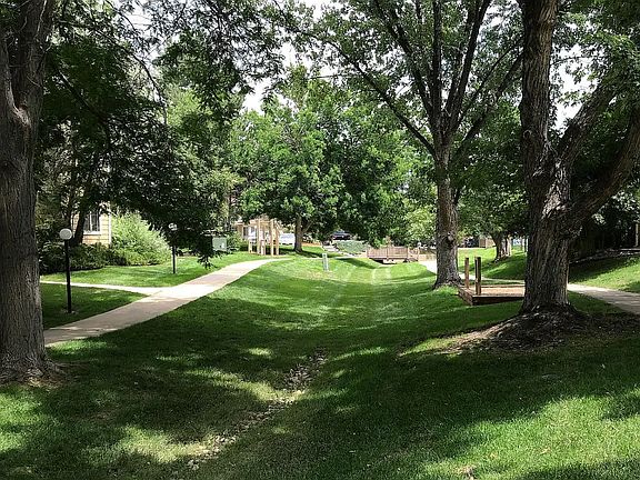 Mature, tree-lined landscape throughout the community