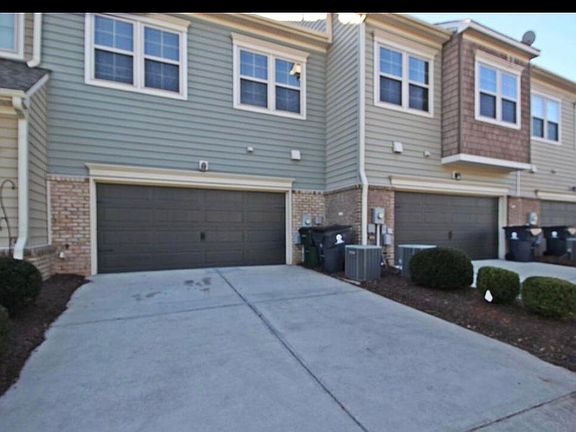 2 car garage with parking in front of garage and then outside spaces available too