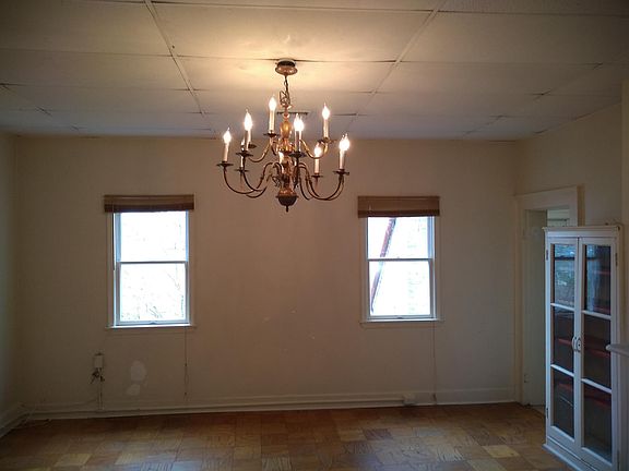 living room/dining room combo with built-in shelves, decorative FP