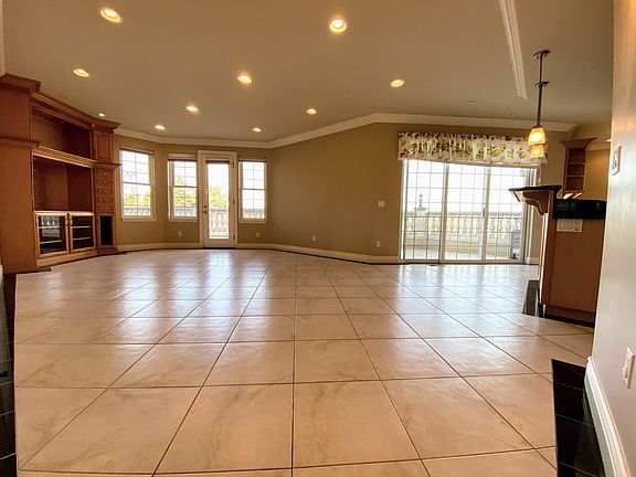 lower level family room/kitchen side - two entrances to the rear wrap patio