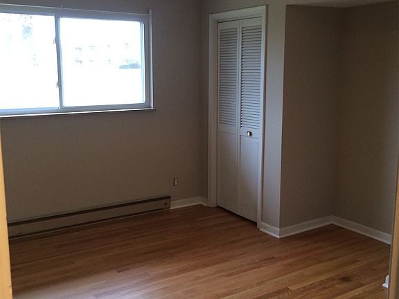 Bedroom with refinished hardwood floors