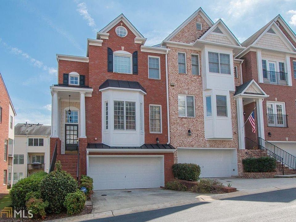 Two-car attached garage with two more spaces in the driveway