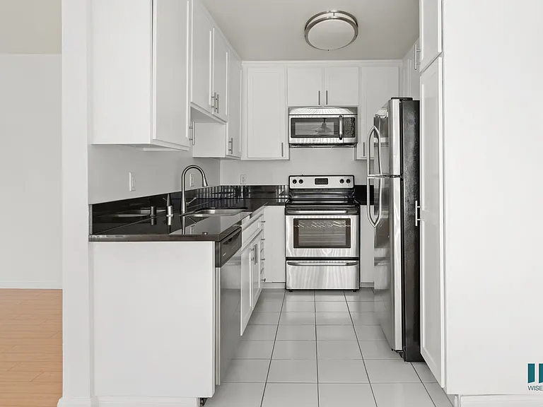 Kitchen with Stainless-Steel Refrigerator, Stove, Microwave Oven, and Dishwasher