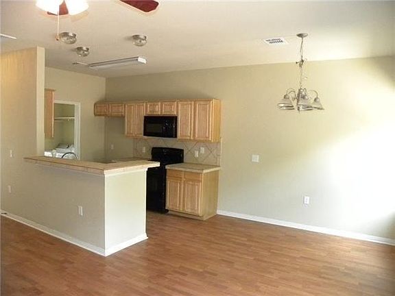 Large downstairs with open layout into the kitchen. Convenient laundry nook.