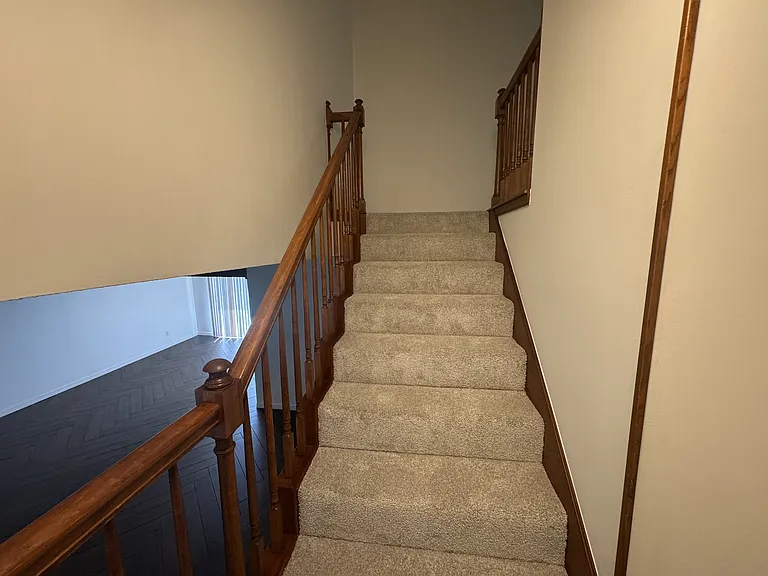 Partial view of living and dining room from the stairs