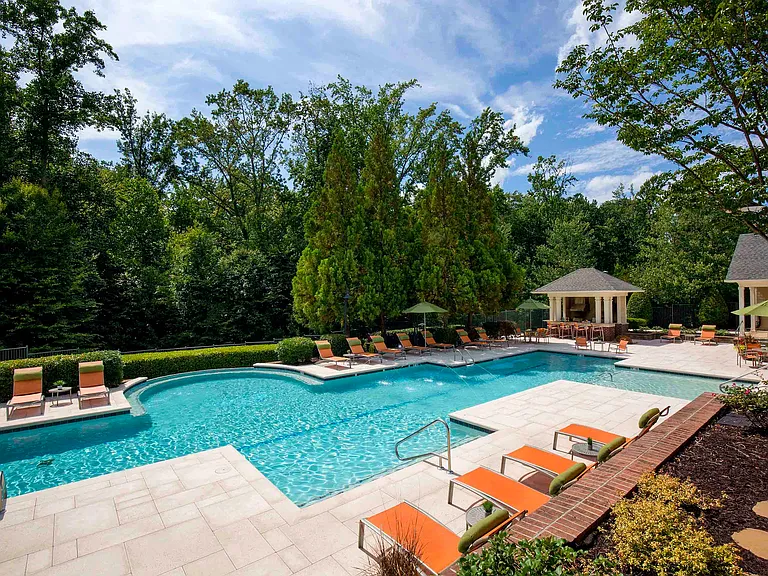 Resort-style pool and expansive sundeck with lounge seating