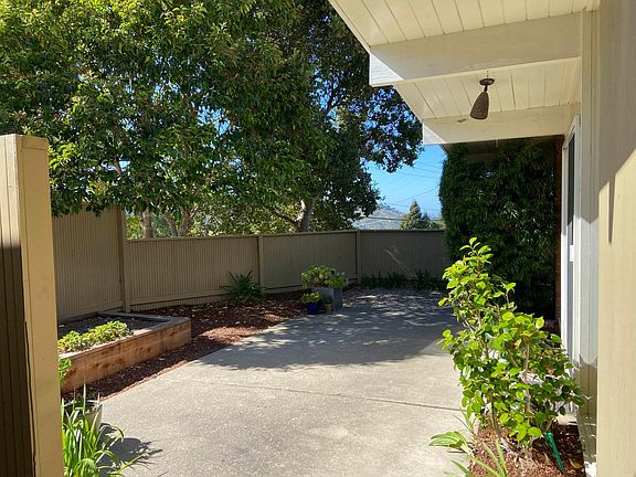 Private front patio adjacent to the kitchen. Views of Hillsborough and the Bay Bridge in the distance.