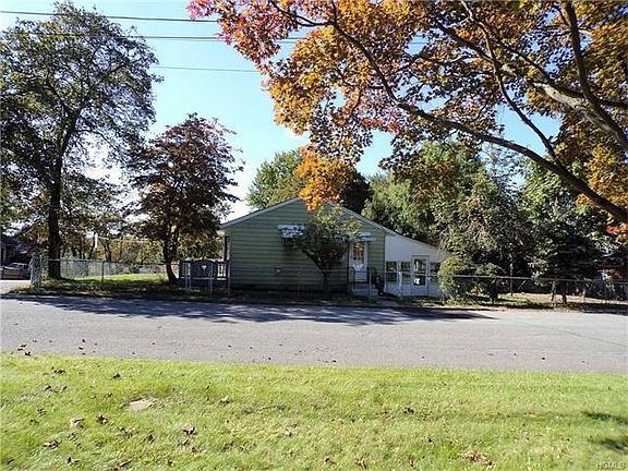 Large fenced in yard and 3 season room