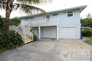 Vacation Lane Bay-Front with lower level guest quarters, pool with spa, pier and dock.