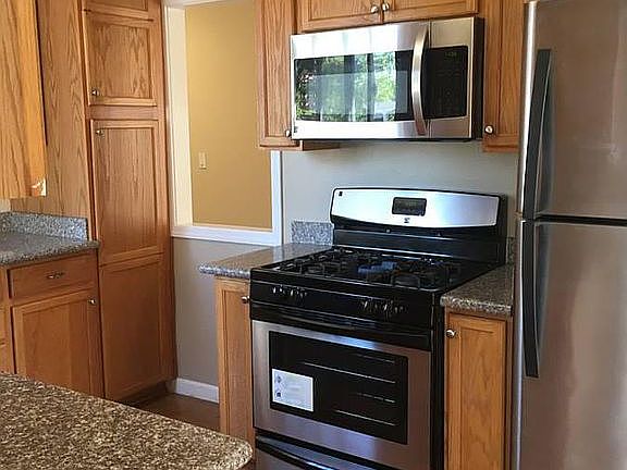 stainless steel refrigerator, build in microwave, gas stove and oven. New cabinets granite counter tops