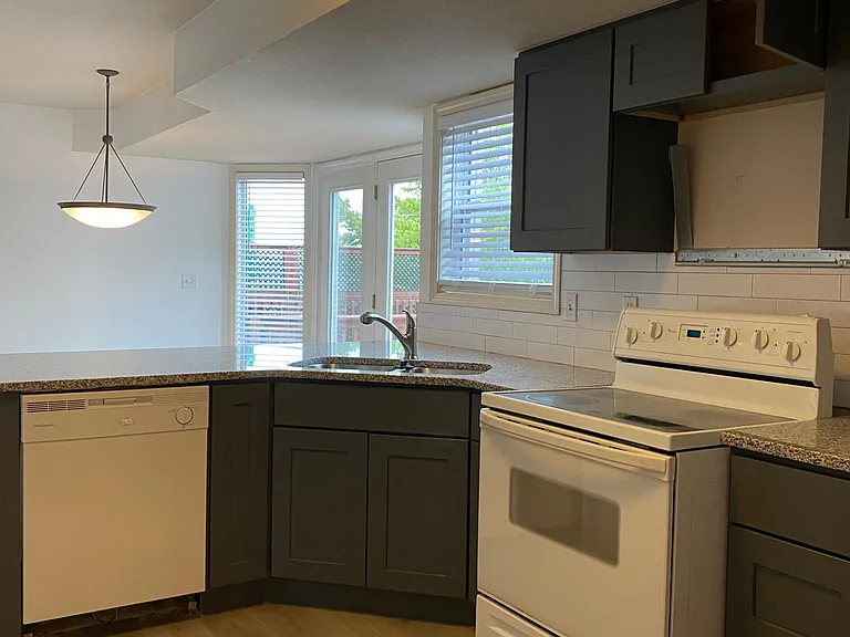 Kitchen includes, dishwasher, stove, microwave and refrigerator