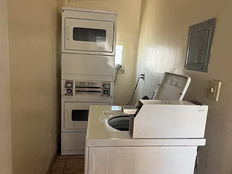 Laundry attached to the house, shared with small 4 unit in rear of the property.