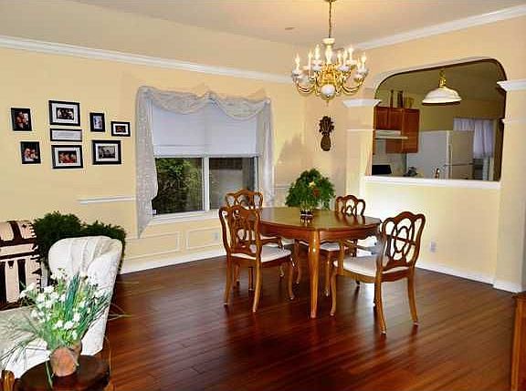 Dining area flows into living room with fireplace
