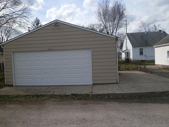 Large Two Car Garage + parking pad.