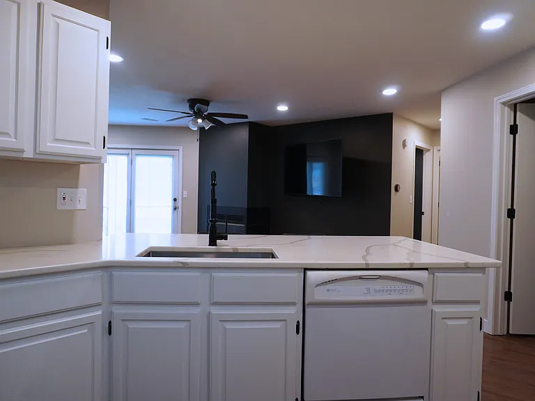 Open kitchen concept with a seamless view of the living room and bartop seating_perfect for entertaining and easy flow throughout the space.