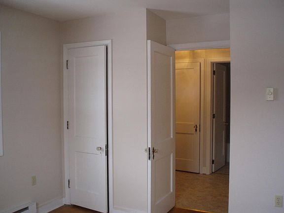 View from Bedroom into hall, bedroom closet.