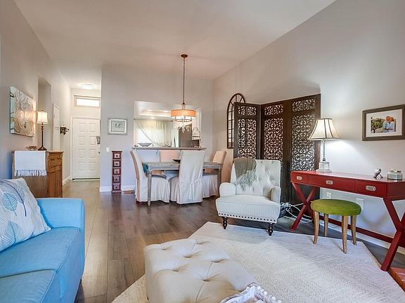 Living room with Kitchen and Front Door in background