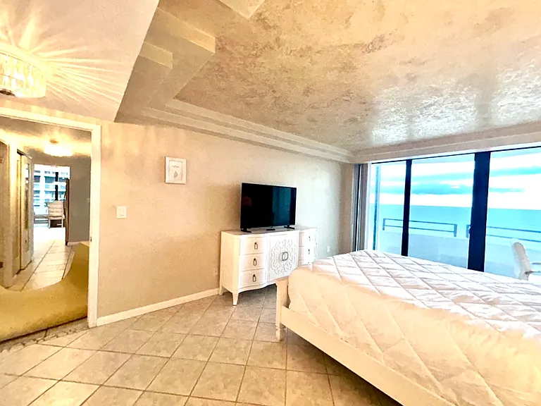 Primary bedroom with unique art deco tray ceiling