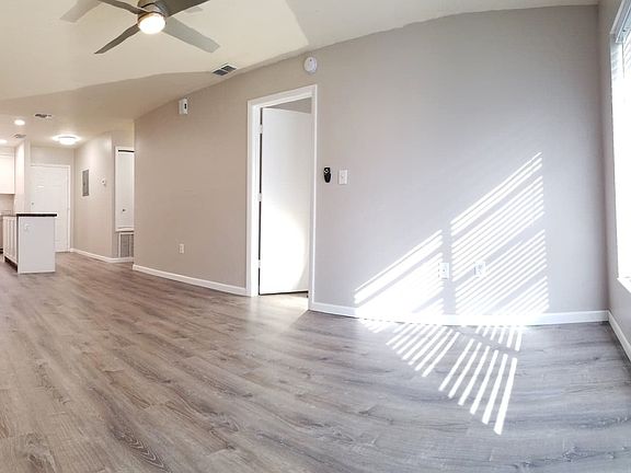 NEW Silver oak Life-Proof luxury vinyl plank flooring. Walls are a calming Greige color that will compliment your furniture.