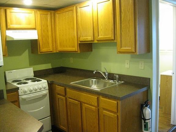 Kitchen with stove and oak cabinets