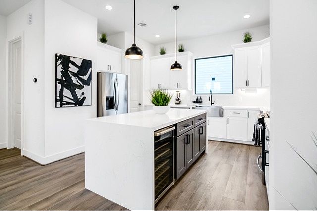 Modern kitchen with a sleek bar space, ideal for casual dining
