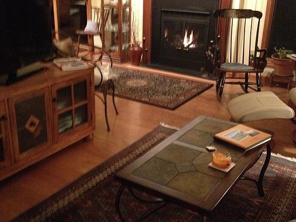 living room , gas fireplace, patio doors to left of fireplac
