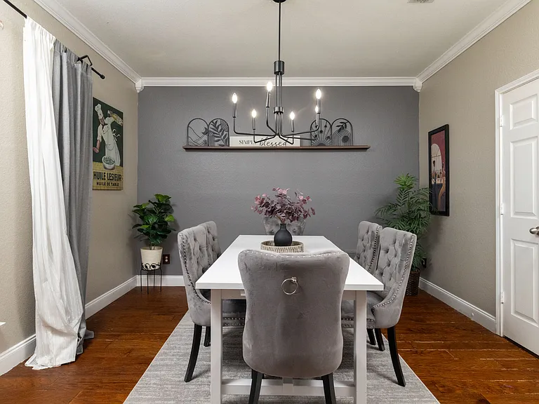 Elegant formal dining room with plush velvet seating, perfect for group dinners.