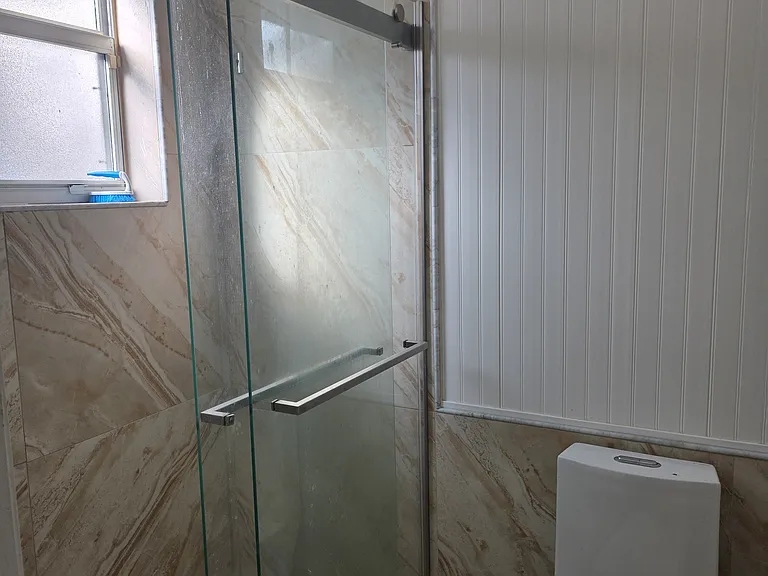 Bath 3 with Rain Shower and Floor to wall large tiles, single piece toilet with dual flush